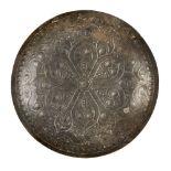 An inscribed Ghaznavid engraved metal dish, Iran, 11th century, of circular form, with six-