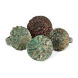 A group of four bronze rings, 1st millennium B.C., Caspian Sea, each with flat round bezel with