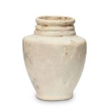 A Bactrian marble vase, 3rd millenium B.C., with foot ring, high shoulder, three rings to neck, 7.