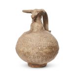 An unglazed pottery jug with ram head spout, Iran, 10th century, of globular form, the body with