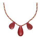 An Egyptian gold and red glass three tear necklace, New Kingdom, 14th century B.C., on a string of