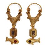 A pair of garnet-set gold earrings with fish, 2nd century B.C. -1st century A.D., the suspension