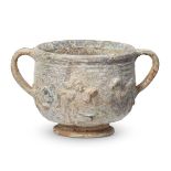 A Roman lead-glazed pottery skyphos with moulded decoration, circa 1st century A.D., with ring