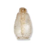 A carved rock crystal perfume bottle, India, early 20th century, with leaf design to body, missing