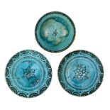 Three Kubachi ware turquoise-glazed pottery dishes, Iran, 18th century, underglaze painted in black,