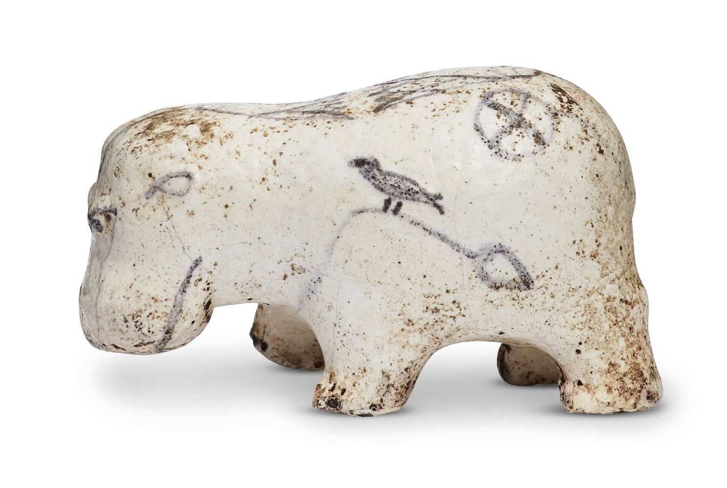 An Egyptian white glazed painted limestone hippopotamus, Middle Kingdom, circa 2055-1600BC.,