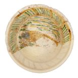 A very large Byzantine fragmentary pottery bowl, 6th-7th century, decorated to the interior with