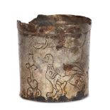 An incised silver vessel with birds, flower and inscription cartouche in ancient Greek, 6.1cm.