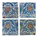 A group of four large Iznik-style tiles and a fragment, 19th-20th century, underglaze painted in