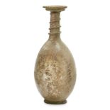 A late Roman light green glass flask, Eastern Mediterranean, 3rd-4th century AD, the flaring