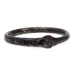 A Byzantine black glass bangle, Eastern Mediterranean, 5th-7th century AD, with a pincered join, 8.