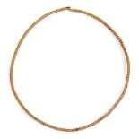 A twisted solid gold torc necklace, 16.5cm. diam., weight 60.5gr. Provenance: Property of a