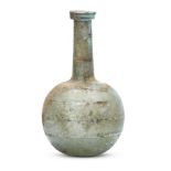 A Roman bluish-green glass bottle, 1st-2nd century A.D., with a folded collar rim on a long