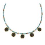 An ancient coloured glass necklace with Egyptians heads in modern gold pendant mounts, 1st-2nd