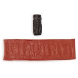 A back steatite cylinder seal with cows, circa 2500 BC, 3.2cm highPlease refer to department for