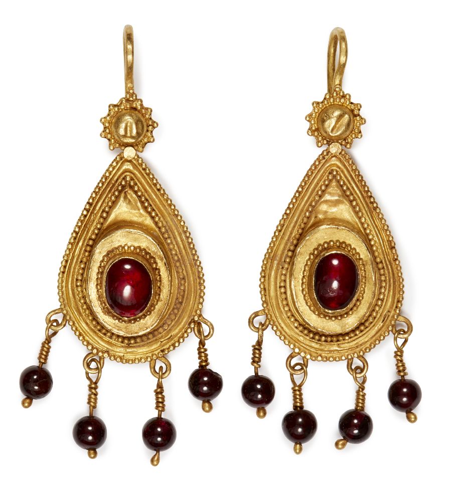 A pair of Hellenistic gold earrings, 1st century AD., of teardrop form set with central garnet and