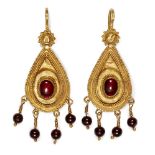 A pair of Hellenistic gold earrings, 1st century AD., of teardrop form set with central garnet and