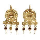 A pair of Etruscan gold sheet earrings, the pendant in the form of a flowerhead with openwork edges,