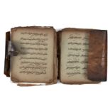 A North African Qur'an in animal skin, 19th century or earlier, unbound, 9ll. of sepia script to the