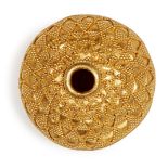 A large gold bead with filigree decoration, of spherical form, decorated in two halves with