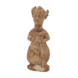 A Sasanian ivory fertility figure, Iran, 6th century, carved as a woman in a seated position,