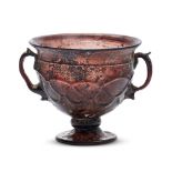 A Late Roman or Byzantine two-handled footed cup, probably 6th-7th century AD, made in brownish-