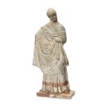 A Greek terracotta figure of a woman, Hellenistic-style, depicted standing on rectangular base,