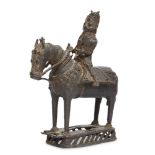 A large bronze figure on a horse, Kerala, 19th century, on a rectangular openwork plinth, the