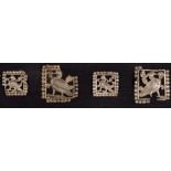 A group of five openwork silver Ordos plaques, 5th-4th century B.C., two large and three small, of