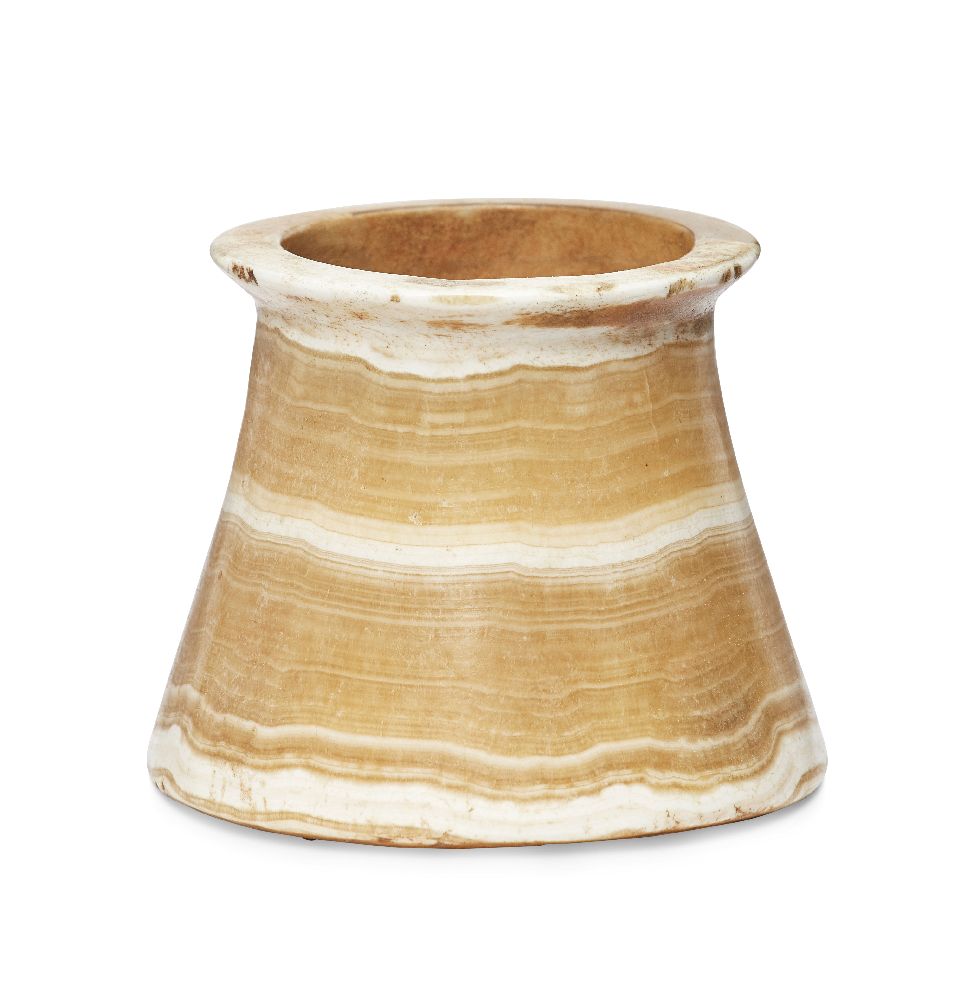 A Bactrian alabaster vessel, 3rd millennium B.C., the tapering cylindrical bowl with a disk rim, 7.