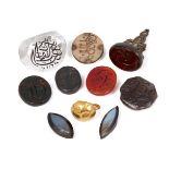 A group of carved personal seals comprising a cut rock crystal seal inscribed with the date of