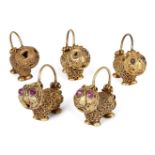 A group of five gold earrings in the form of small lions, Iran, 12th century, some with stone-set