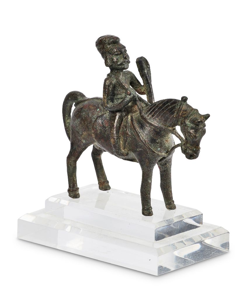 A Parthian bronze horserider, 2nd century B.C.-2nd century A.D., shown holding a staff, 10cm high