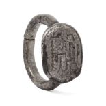 A Hellenistic silver ring with engraved seated figure, 2nd century B.C. - 1st century A.D., 1.8cm.