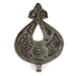 A Seljuq turquoise-set and nielloed silver pendant, Iran, 12th century, of drop form with tri-part