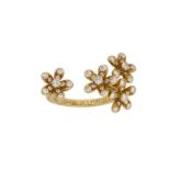 A diamond 'Socrate' ring, by Van Cleef & Arpels, of between the fingers design with four brilliant-
