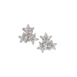 A pair of diamond cluster earclips, each clip designed as a marquise diamond triple cluster with