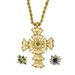 An emerald-set pendant necklace and a synthetic sapphire and diamond ring, the scroll design