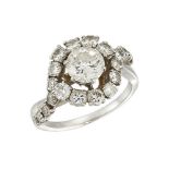 A diamond cluster ring, the single brilliant-cut diamond centre to crossover surround of brilliant-