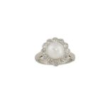 A cultured pearl and diamond cluster ring, the central cultured pearl within a surround of
