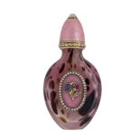 An Imperial Russian gold and enamel scent bottle, the oval mottled pink and brown glass bottle