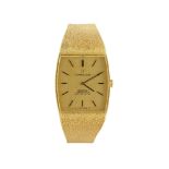 An 18ct gold automatic 'Constellation' wristwatch by Omega, the rectangular textured dial with bowed