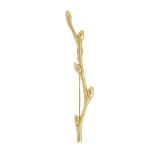 A 'Love Branch' brooch, by Tiffany, the branch with bud detail, signed Tiffany & Co, 9.0cm long,