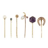 A group of six stickpins, including: one with diamond single stone top; one with octagonal shaped