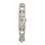 A lady's Art Deco platinum and diamond wristwatch, the rectangular silvered dial with Arabic