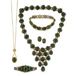 A collection of Brazilian Tortoise Leaf beetle jewellery, comprising: a necklace; a panel link