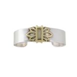 A two colour 'Acanthus' bangle by Helen Woodhull, of torc design with central stylised twin palmette