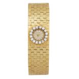 A lady's 18ct gold diamond bracelet watch, by Beuche Girod, the circular dial with applied baton