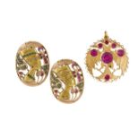 Two Egyptian style brooches / pendants and a synthetic ruby pendant, each similarly designed