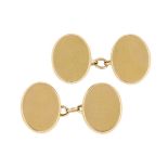 A pair of 18ct gold cufflinks, of polished oval panel design with chain link connections, London